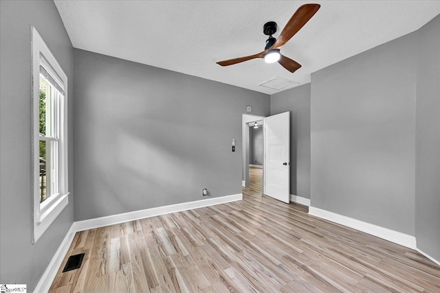 23 Stringer St, Belton, SC 29627 - spare room with wood finished floors, ceiling fan, and a textured ceiling