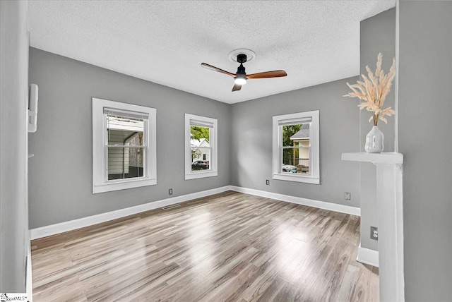 23 Stringer St, Belton, SC 29627 - spare room with a textured ceiling, ceiling fan, and wood finished floors