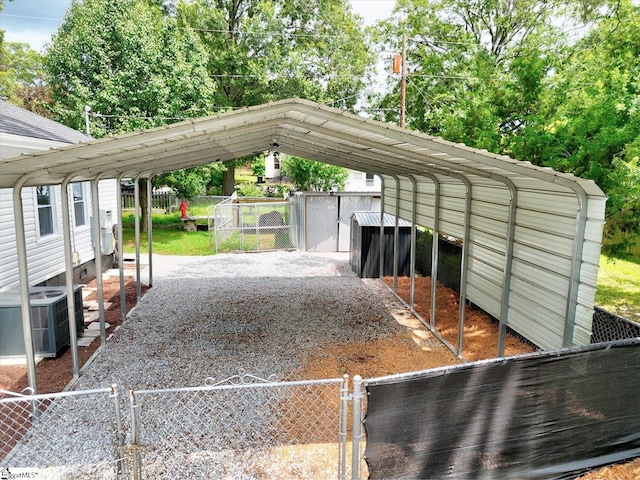 23 Stringer St, Belton, SC 29627 - view of vehicle parking featuring a carport, a gate, and driveway