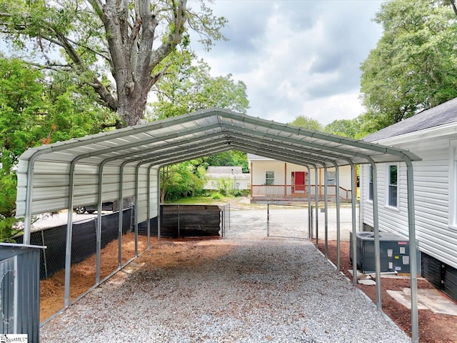 23 Stringer St, Belton, SC 29627 - view of car parking featuring a detached carport and driveway