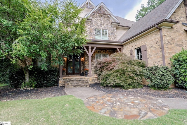 108 Ledgestone Way, Greer, SC 29651 - craftsman-style home featuring french doors, stone siding, and a shingled roof