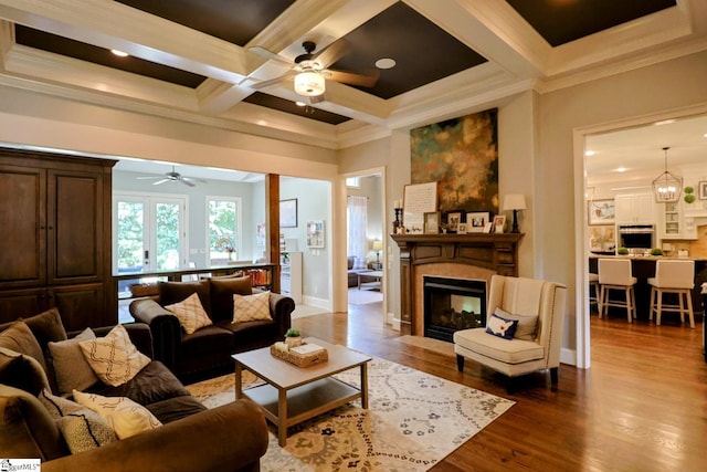 108 Ledgestone Way, Greer, SC 29651 - living room featuring a ceiling fan, a fireplace, coffered ceiling, dark wood finished floors, and ornamental molding