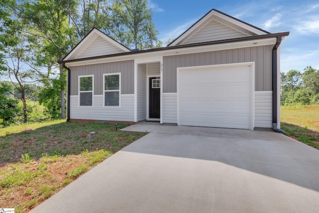 317 R C Thompson Rd, Chesnee, SC 29323 - view of front of property with driveway and a garage
