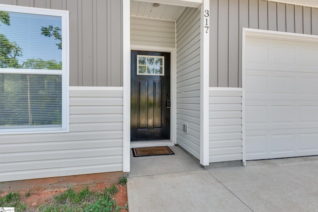 317 R C Thompson Rd, Chesnee, SC 29323 - property entrance featuring board and batten siding and an attached garage