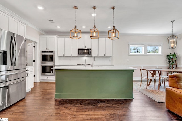 214 Terrapin Cross Way, Simpsonville, SC 29680 - kitchen featuring appliances with stainless steel finishes, ornamental molding, white cabinetry, light countertops, and dark wood-style flooring