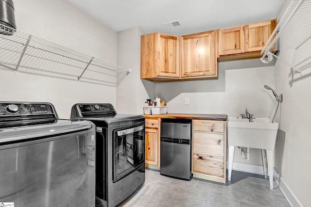 214 Terrapin Cross Way, Simpsonville, SC 29680 - washroom featuring separate washer and dryer, cabinet space, light tile patterned floors, and bar