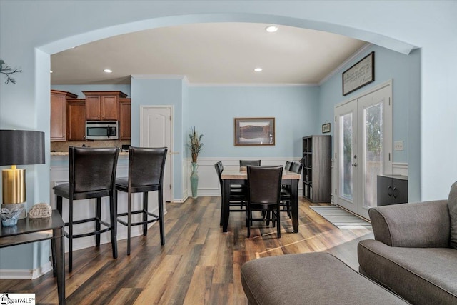 114 Eagles View Ct, Easley, SC 29642 - dining area with arched walkways, ornamental molding, dark wood-type flooring, recessed lighting, and french doors