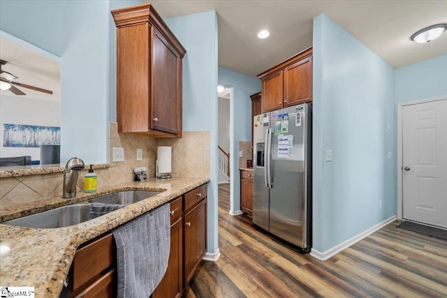 114 Eagles View Ct, Easley, SC 29642 - kitchen featuring stainless steel fridge with ice dispenser, dark wood-style floors, light stone countertops, ceiling fan, and tasteful backsplash