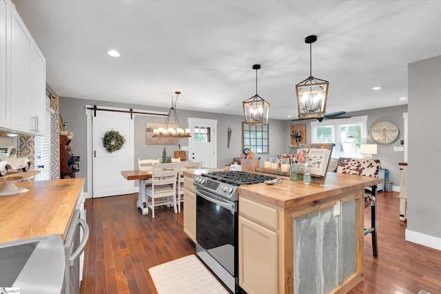 301 Ridgecrest Dr, Easley, SC 29640 - kitchen with wooden counters, appliances with stainless steel finishes, a barn door, dark wood-style flooring, and recessed lighting