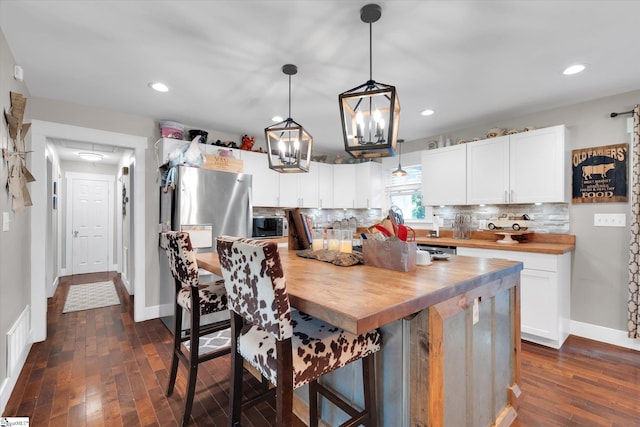 301 Ridgecrest Dr, Easley, SC 29640 - kitchen with wooden counters, backsplash, dark wood-style floors, white cabinets, and recessed lighting