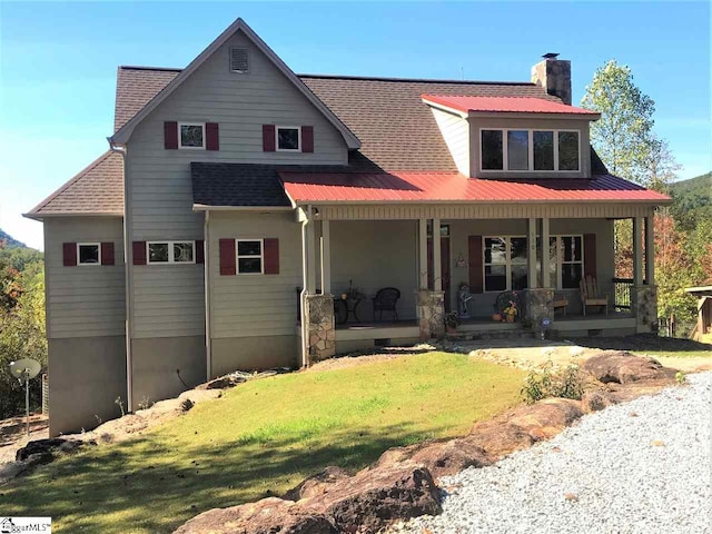 view of front of property featuring a porch and a front lawn