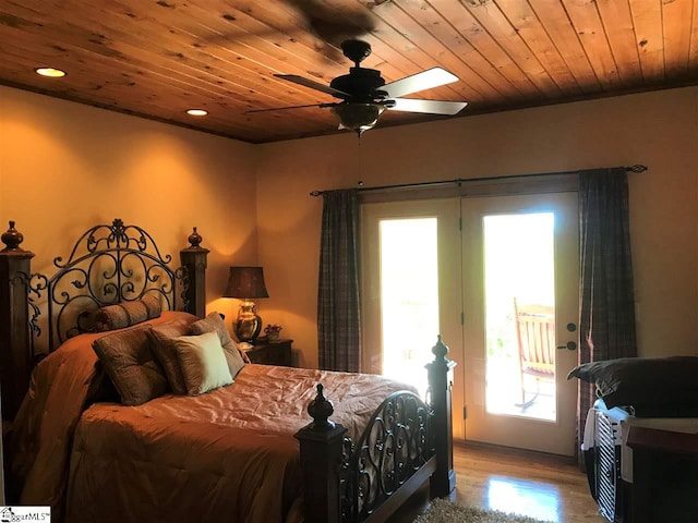 bedroom featuring light hardwood / wood-style floors, wood ceiling, access to exterior, and ceiling fan