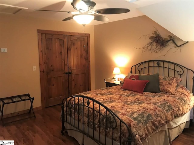 bedroom with dark hardwood / wood-style floors and ceiling fan