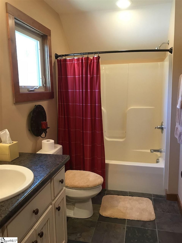 full bathroom with tile flooring, toilet, shower / bath combo, and vanity