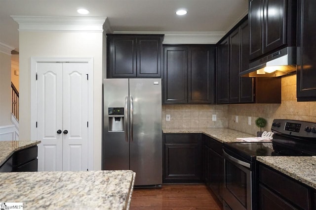 kitchen featuring crown molding, light stone countertops, stainless steel appliances, and dark hardwood / wood-style floors