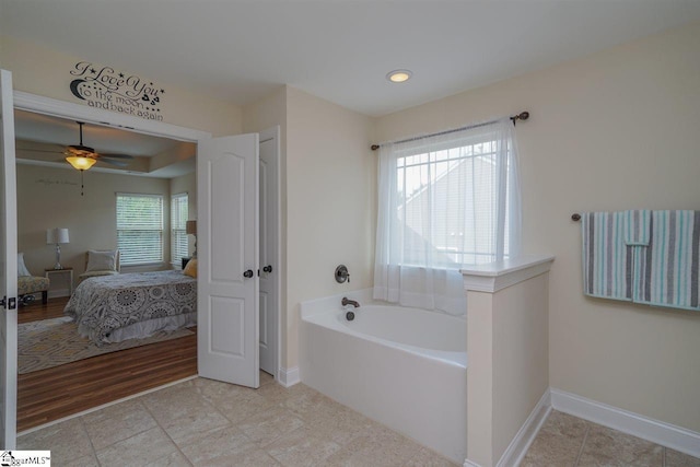 bathroom featuring a bath, tile flooring, and ceiling fan