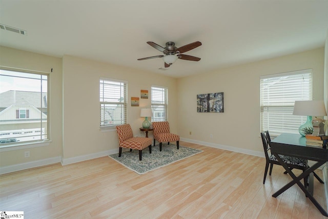 sitting room featuring ceiling fan and light wood-type flooring