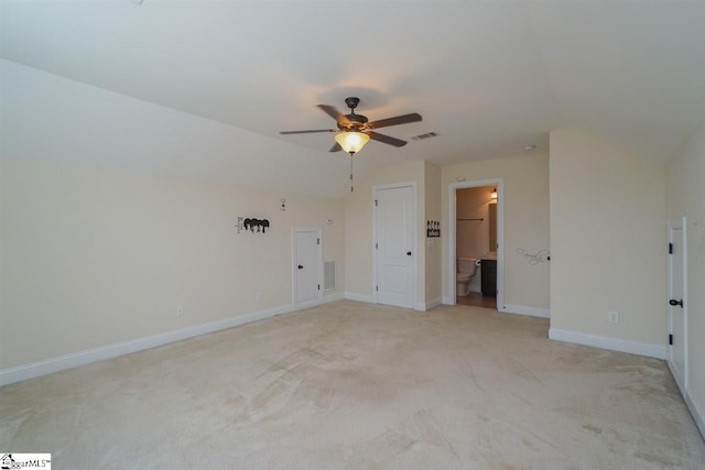 spare room with light carpet and ceiling fan