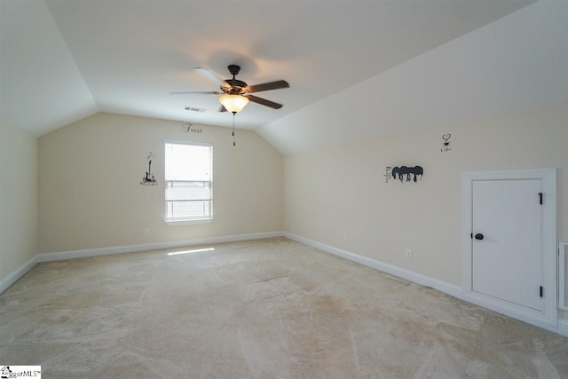 bonus room featuring lofted ceiling, ceiling fan, and light carpet