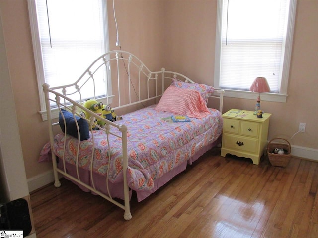 bedroom with hardwood / wood-style floors