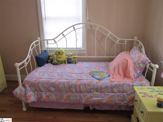 bedroom featuring dark hardwood / wood-style flooring