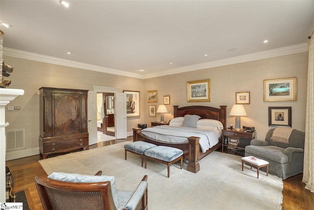 bedroom featuring ornamental molding and dark hardwood / wood-style flooring