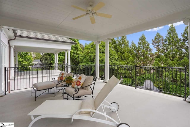 view of terrace featuring a balcony and ceiling fan