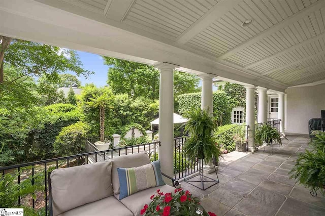 view of patio featuring a balcony