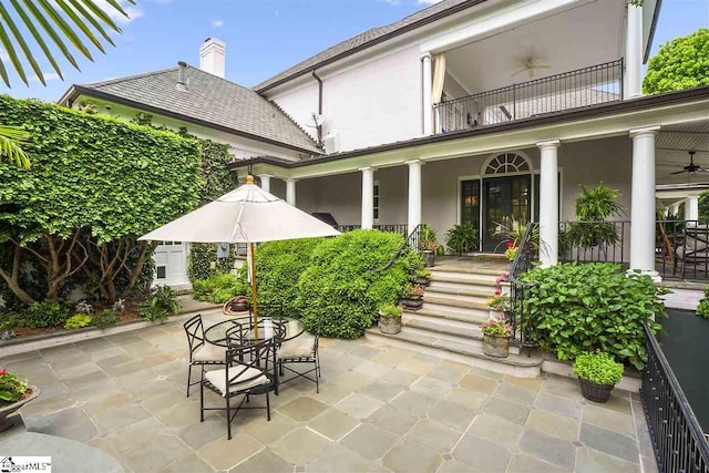 exterior space with ceiling fan, a balcony, and a patio area