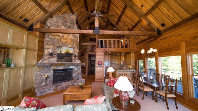 living room featuring a stone fireplace, high vaulted ceiling, wood ceiling, and beam ceiling