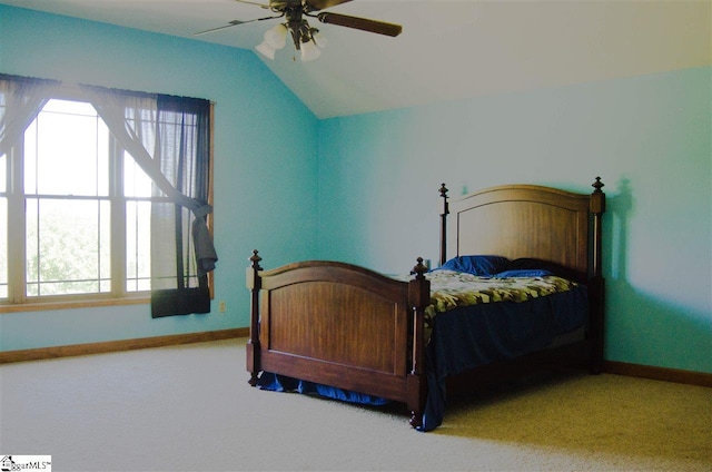 carpeted bedroom featuring ceiling fan and lofted ceiling