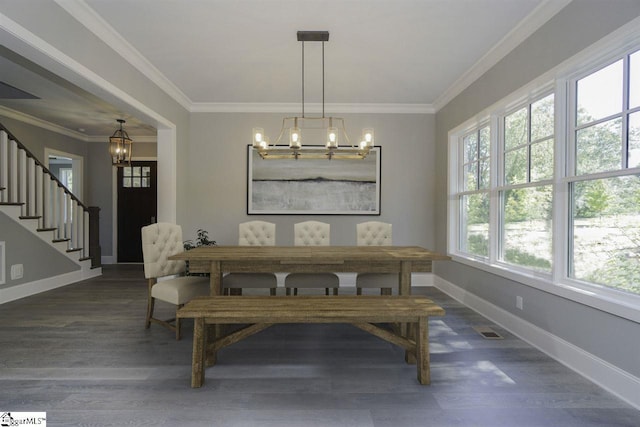 unfurnished dining area with an inviting chandelier, dark wood-type flooring, and ornamental molding