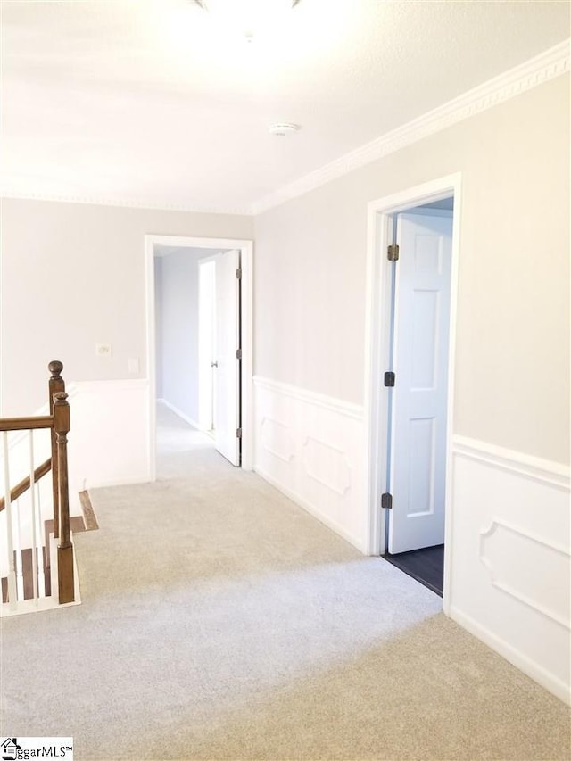 carpeted spare room with ornamental molding