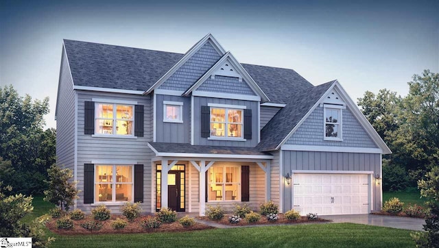 craftsman-style home featuring a front yard and a garage