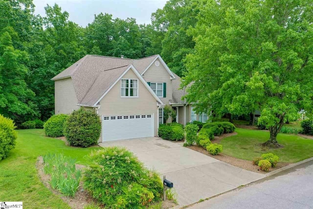 front facade with a front yard and a garage