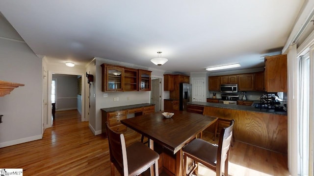 dining space featuring light hardwood / wood-style flooring