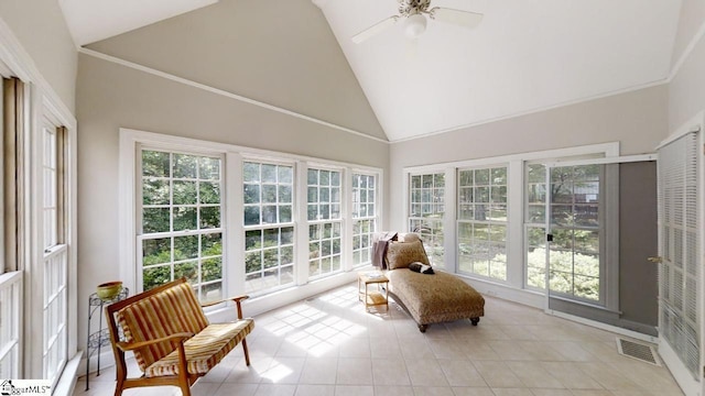 sunroom / solarium with ceiling fan and vaulted ceiling