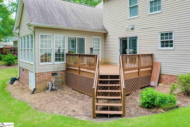 back of house featuring a wooden deck