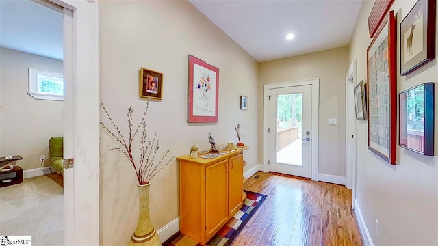 doorway with light wood-type flooring