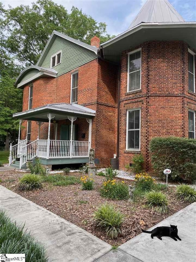 view of front of house featuring central AC and covered porch