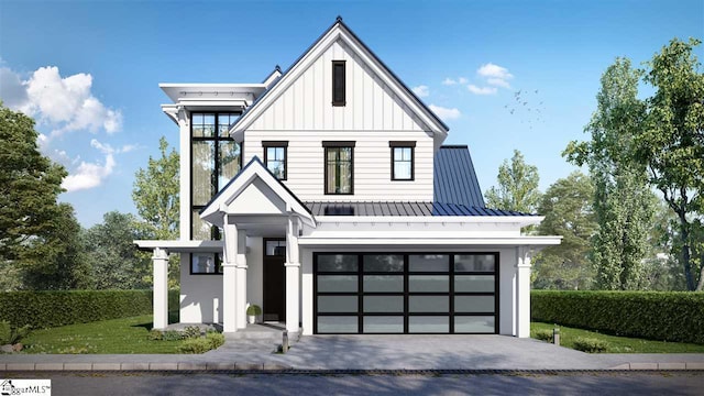 modern inspired farmhouse with a garage