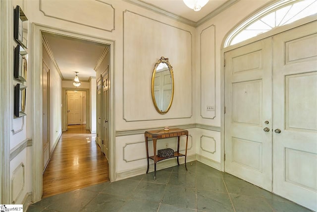 entryway featuring crown molding and dark hardwood / wood-style flooring