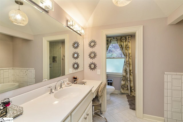 bathroom featuring lofted ceiling, oversized vanity, toilet, and tile floors