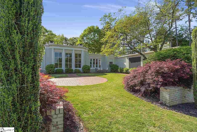 view of yard with french doors