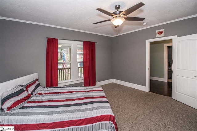 carpeted bedroom featuring ceiling fan, ornamental molding, and a textured ceiling