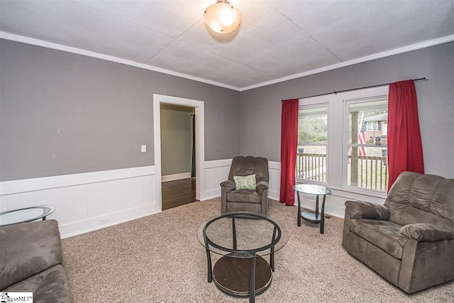 sitting room featuring light carpet and crown molding