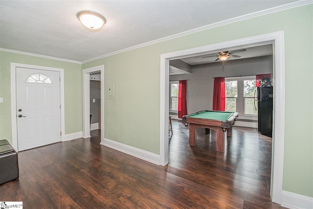 recreation room with pool table, crown molding, ceiling fan, and dark hardwood / wood-style flooring