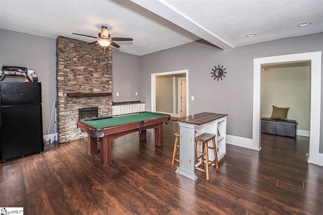 game room with ceiling fan, pool table, dark wood-type flooring, and a fireplace