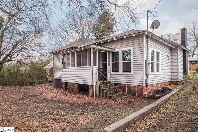 back of property featuring a sunroom