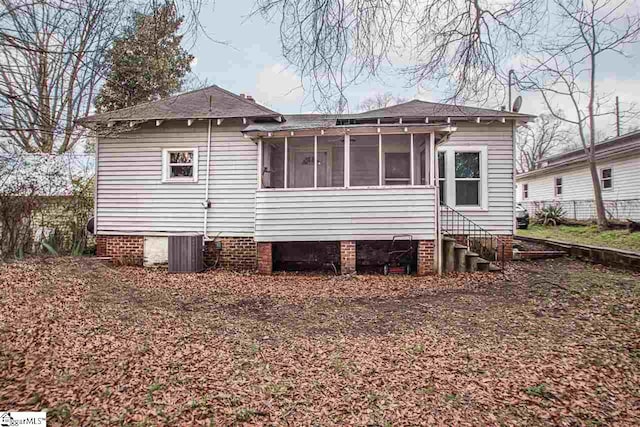 view of home's exterior with a sunroom